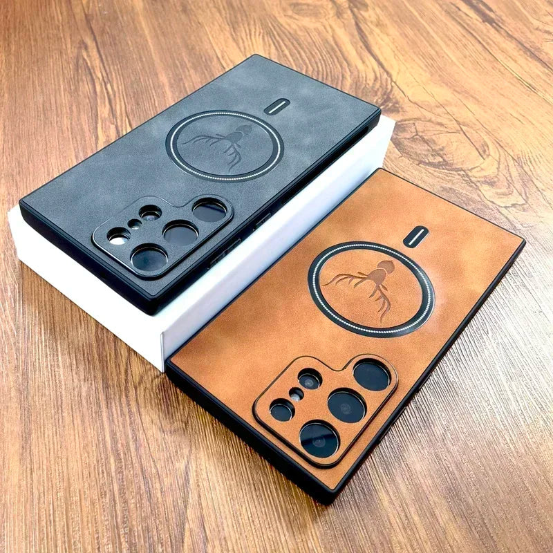 Two smartphone cases with octopus designs, one black and one brown, are displayed on a wooden surface. The black case sits on a white box.