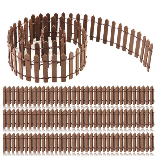Brown miniature picket fence rolls and laid out strips, used for garden decoration or crafts. Each section has evenly spaced vertical slats connected with horizontal wires.