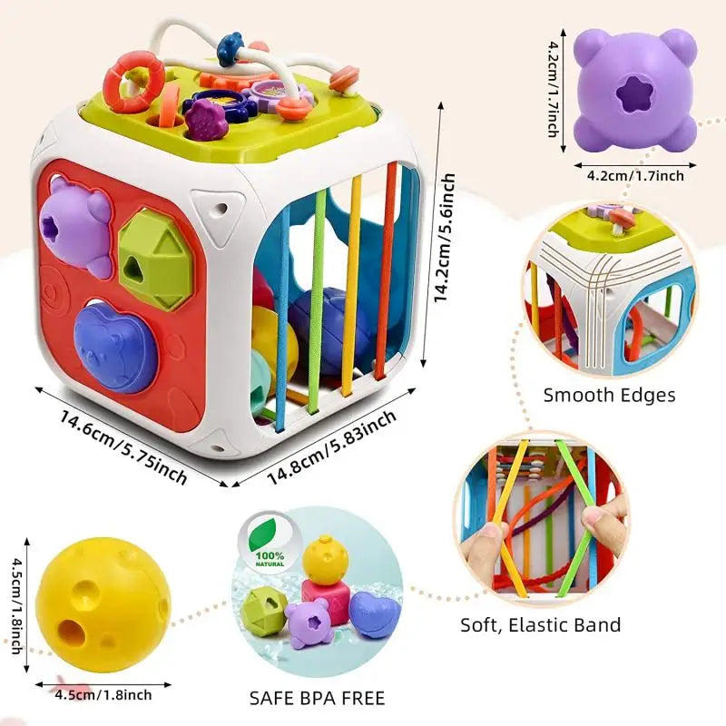 Colorful shape sorter cube toy with smooth edges and elastic bands. Features include geometric holes, soft shapes, and BPA-free materials. Dimensions: 14.8cm and 14.6cm each side.