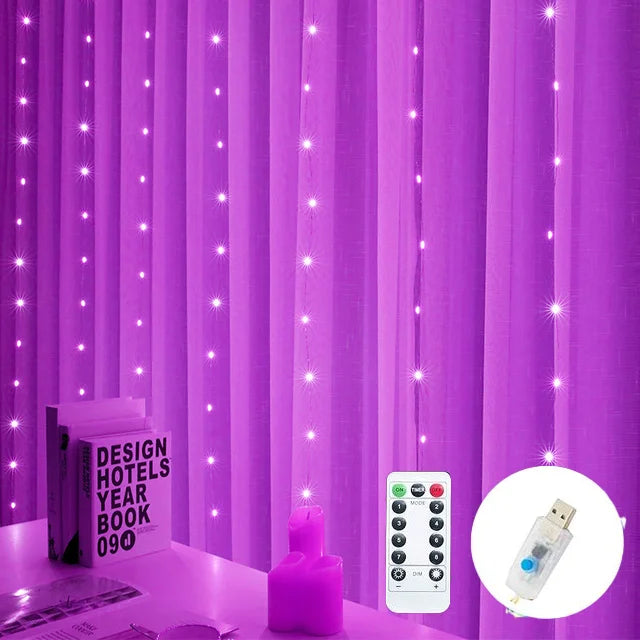 Purple curtain backdrop with strings of glowing fairy lights. A table with a pink candle, book, and remote control is visible. A USB plug is shown in the corner inset.