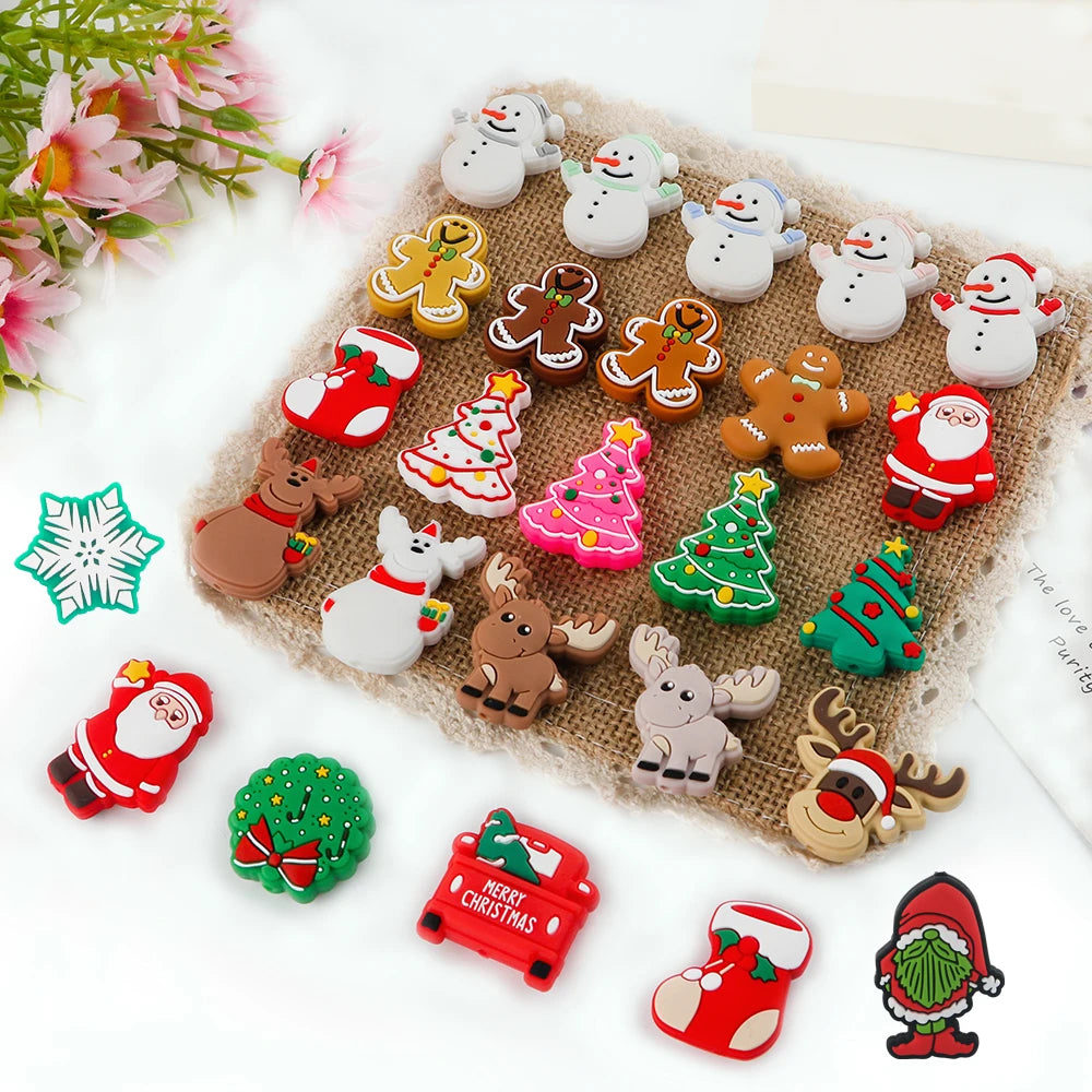 Colorful festive buttons on burlap; featuring snowmen, gingerbread men, Christmas trees, Santa, reindeer, wreath, and stockings. Pink flowers on the side.