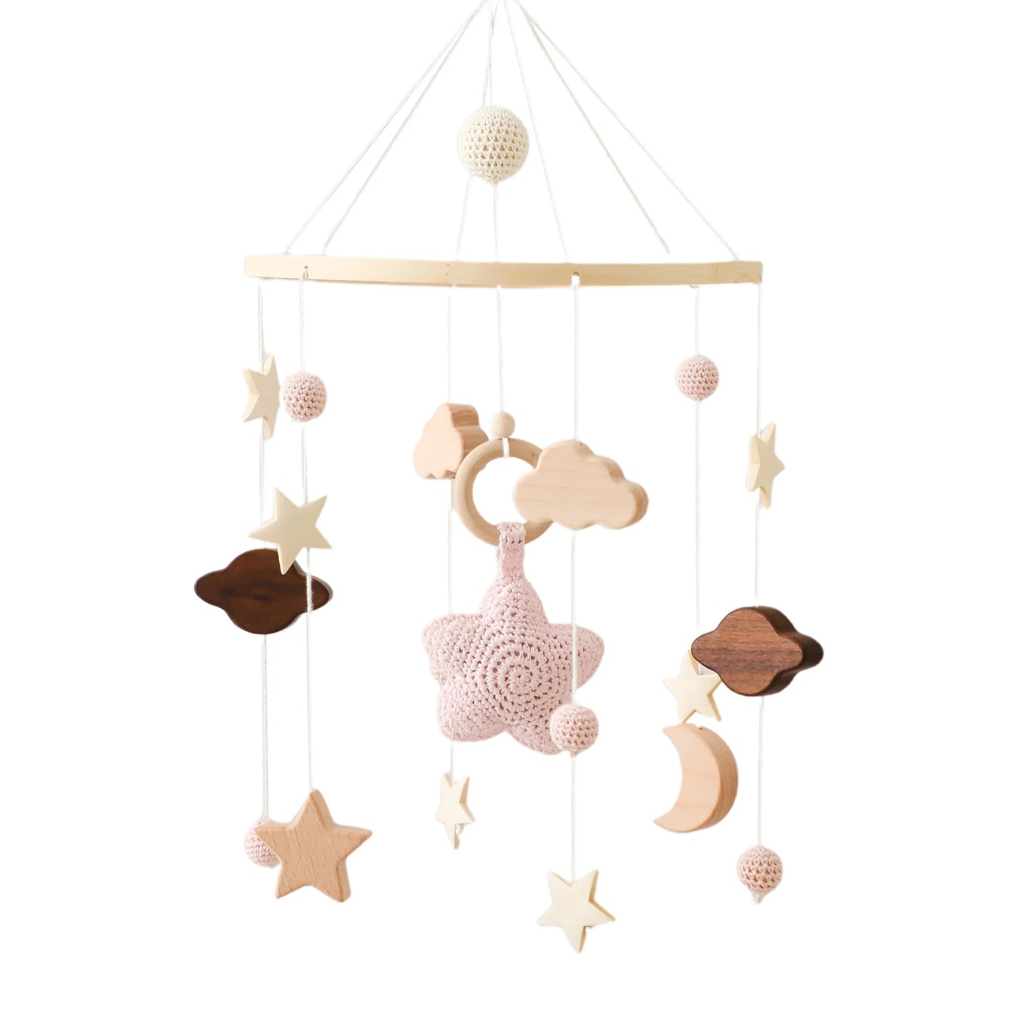 Handmade baby mobile with crocheted pink star, wooden clouds, stars, moon, and soft balls, hanging from a circular frame. Neutral colors create a calming aesthetic.