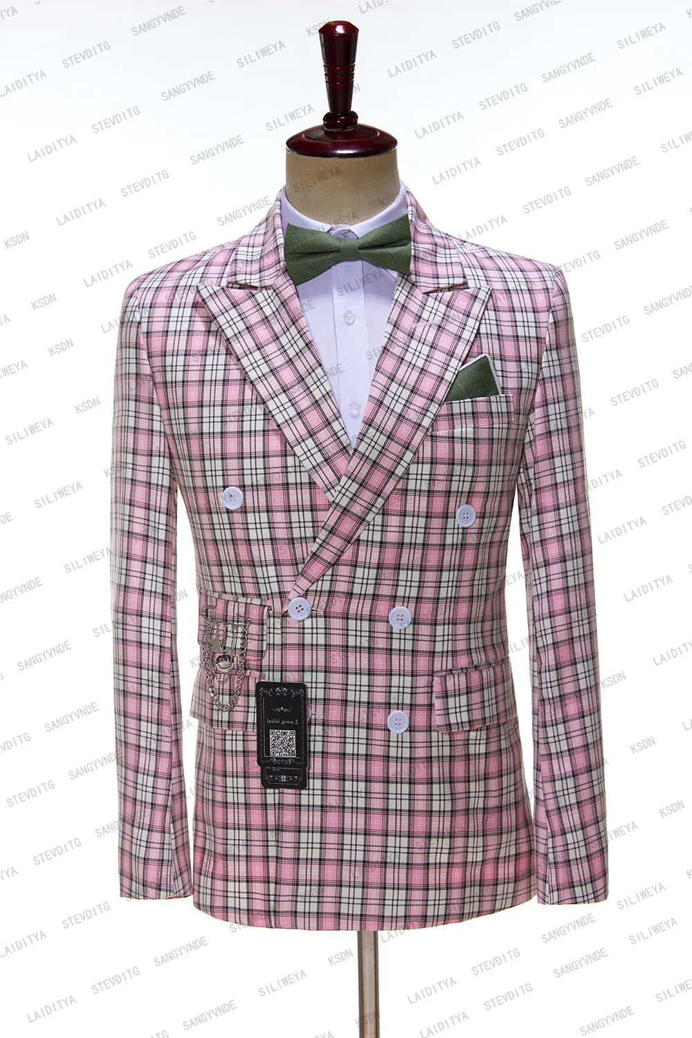 Mannequin wearing a pink plaid double-breasted suit jacket with white buttons, green bow tie, and matching pocket square on a white background.