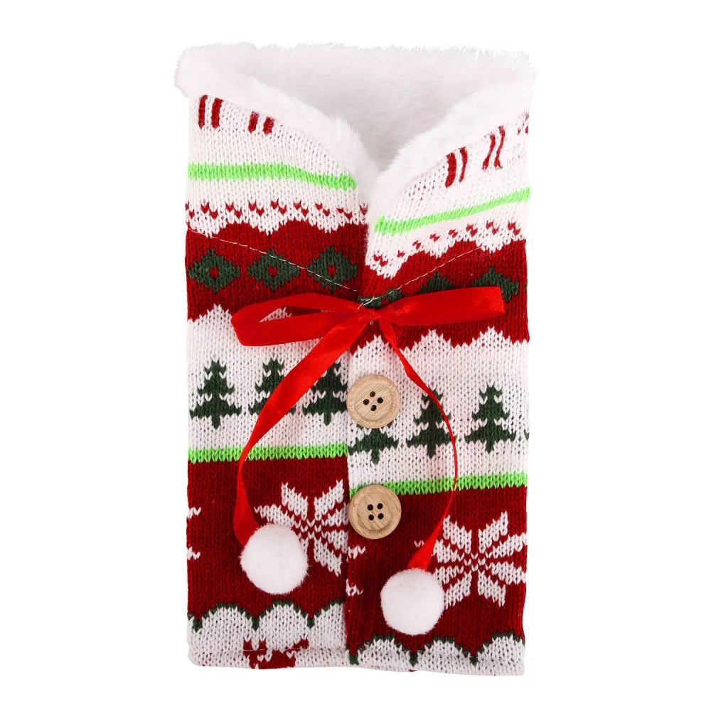 Festive red and white knit sweater with green accents, featuring holiday patterns, wooden buttons, red ribbon, and white pom-poms.