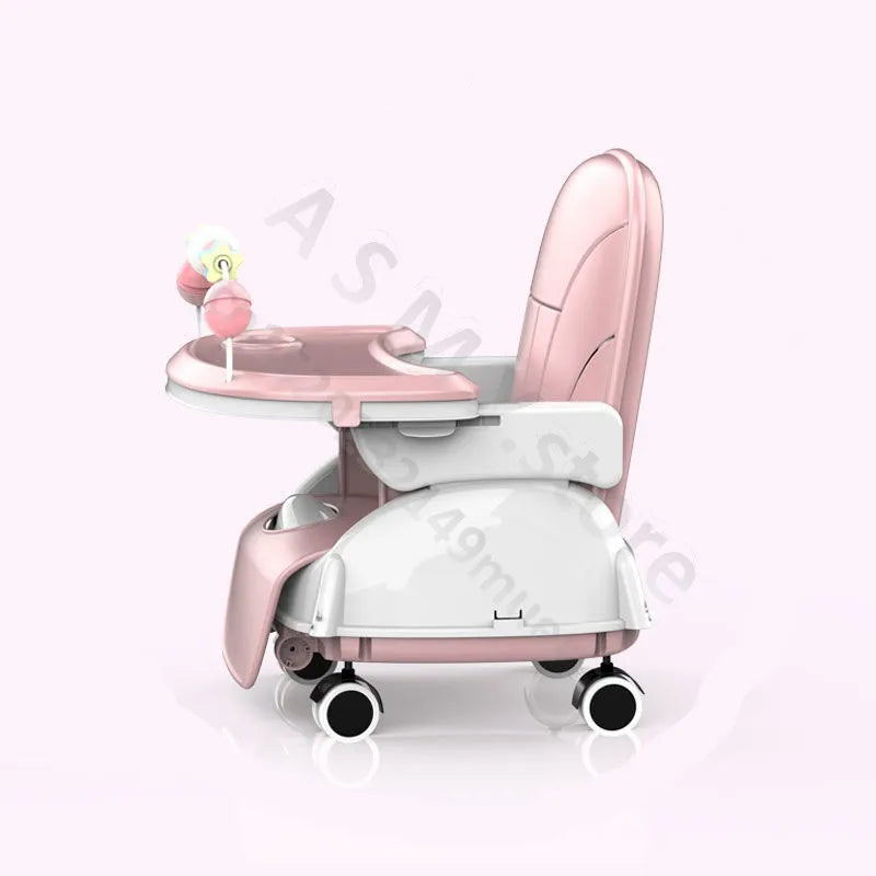 Pink and white baby high chair with wheels, featuring a tray and attached colorful toy. The chair is designed for mobility and convenience, perfect for infant mealtime.