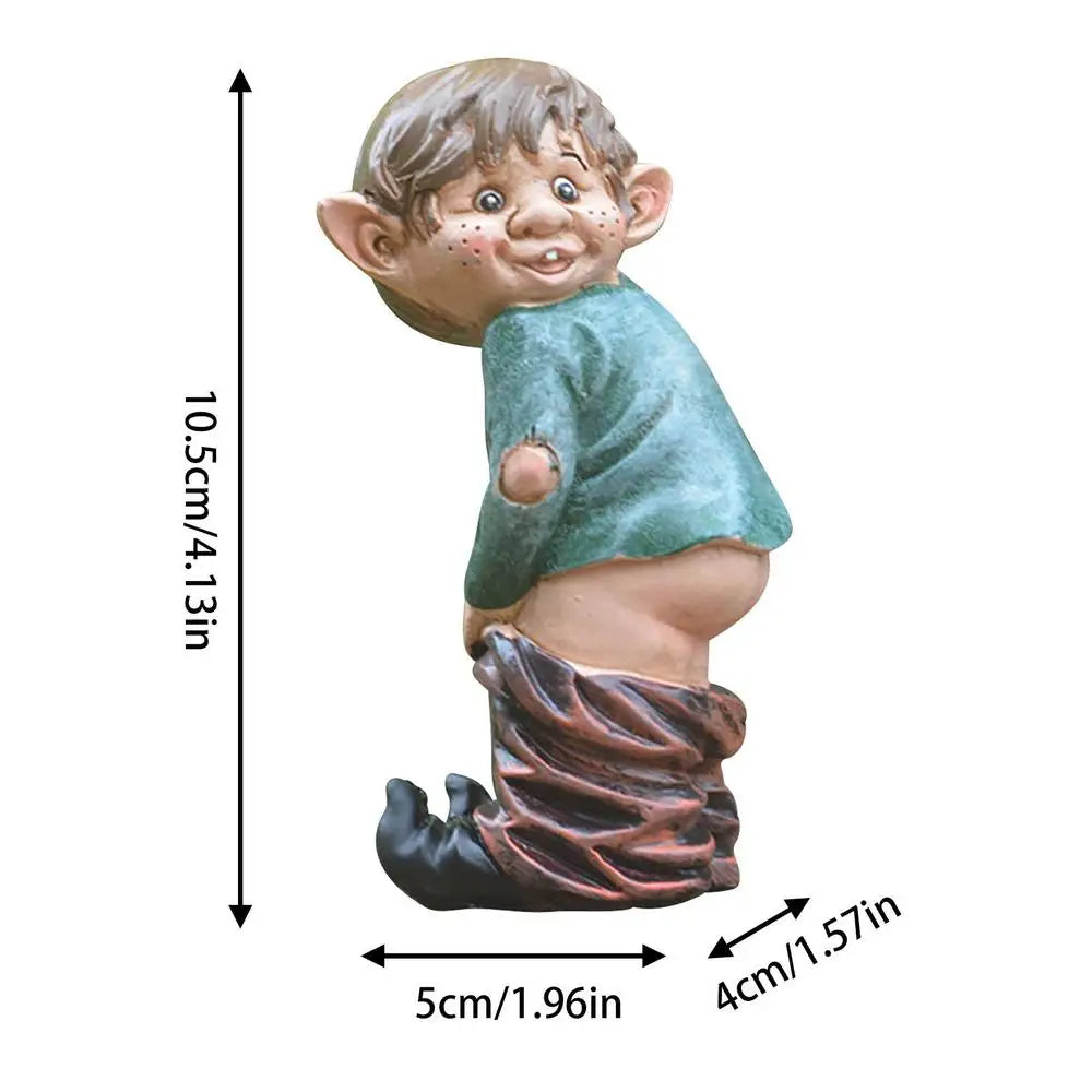Whimsical garden gnome displaying a cheeky pose, with dimensions indicated: 10.5cm tall, 5cm wide, and 4cm deep. The gnome wears a green shirt and partially lowered pants.