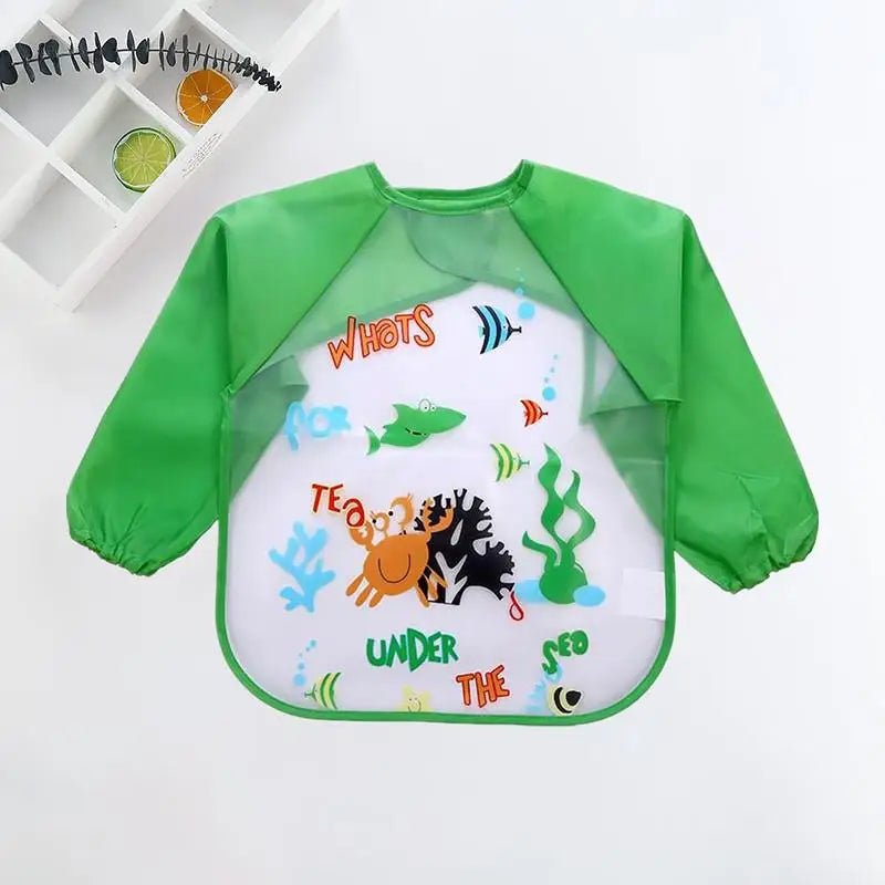 Green long-sleeve bib with fun sea designs including a shark, octopus, and fish. The text "What's Under the Sea" is printed in colorful letters.