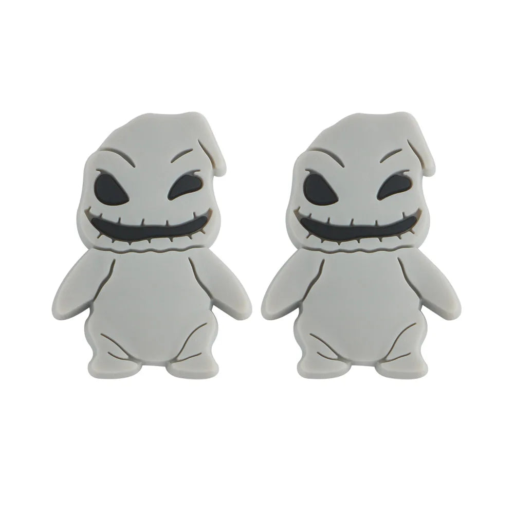 Two identical gray figures with stitched smiles and dark eyes, standing side by side. Their design is simple, with rounded limbs and a smooth, cartoonish appearance.