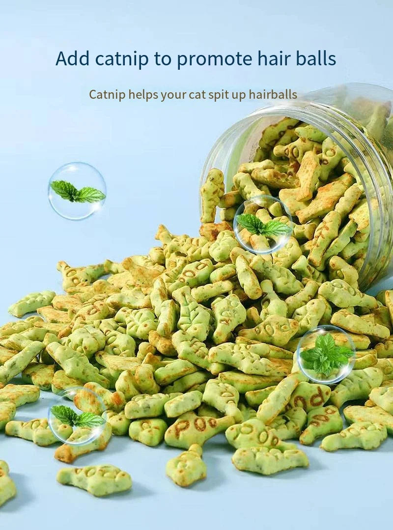 A jar spills out green, fish-shaped cat treats with catnip. Text reads: "Add catnip to promote hair balls. Catnip helps your cat spit up hairballs."