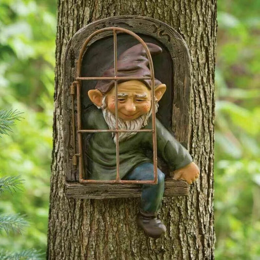 A whimsical gnome figurine leans out of a small window set in a tree trunk, framed by dense greenery. The gnome wears a pointed hat and has a cheerful expression.