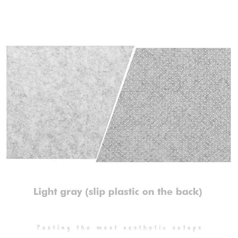 Close-up of two light gray surfaces, one textured like felt, the other like dimpled plastic. Text: "Light gray (slip plastic on the back)" over minimalist design text.