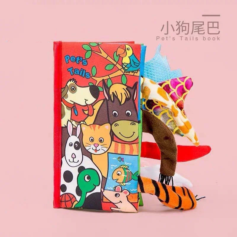 Soft children's book titled "Pet's Tails" with colorful animal illustrations on the cover and various textured animal tails sticking out. Background is a light pink color.