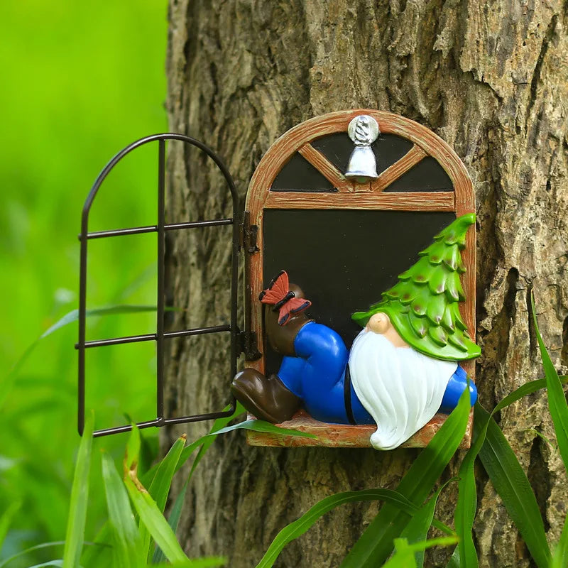 A whimsical gnome with a pine tree hat and blue outfit is lounging at a miniature wooden door on a tree trunk, surrounded by green grass and foliage. A butterfly rests on its boot.