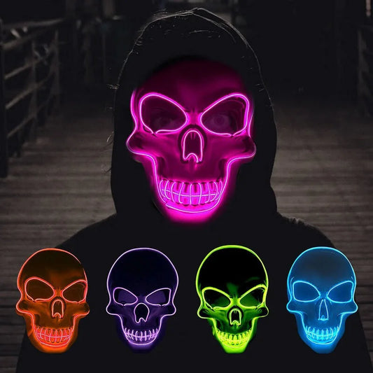 Person wearing a neon pink skull mask in the dark. Below are four masks in orange, purple, green, and blue, each glowing against a shadowy background.