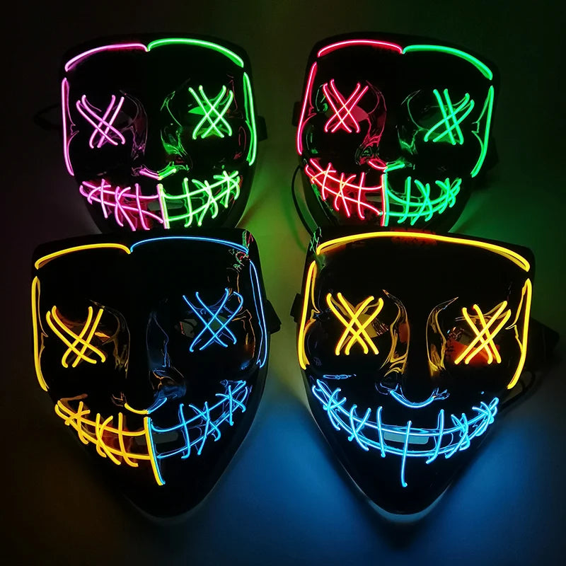 Four glowing LED masks with Xs over eyes and stitched mouths. Masks feature vibrant neon colors: green, pink, yellow, and blue. Masks arranged in a square pattern on a dark background.