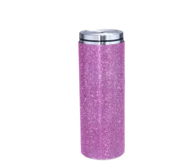A pink glittery tumbler with a silver lid, standing upright against a plain white background.