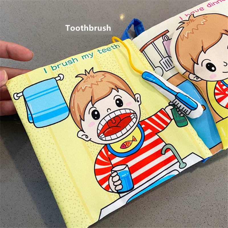 A colorful children's book page shows a cartoon boy in a red striped shirt brushing his teeth at a sink, with a towel on the wall and a blue toy toothbrush attached.