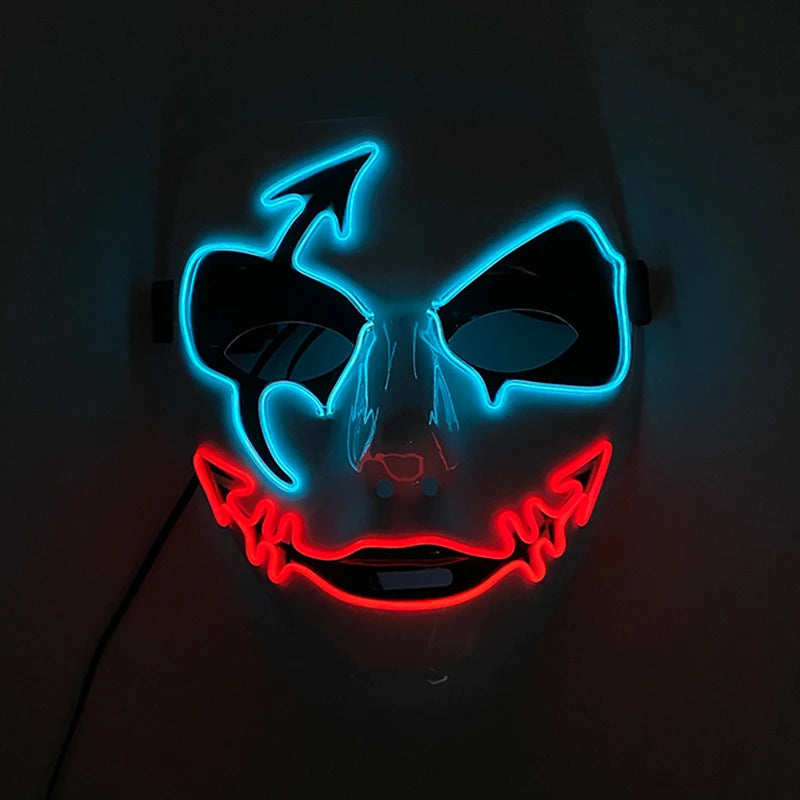 A mask with blue neon outlines and black eye holes. It features devil horns and a red neon smile with sharp, jagged edges, giving it a sinister appearance.