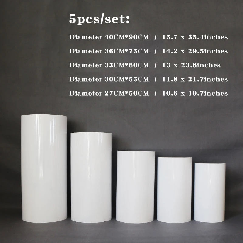 Five white cylindrical pedestals of varying heights and diameters are aligned from tallest to shortest against a dark background with dimensions listed above each.