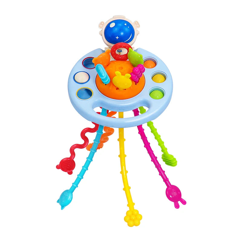Multicolored baby activity toy with a blue base featuring holes, a central orange section with small toys, and six dangling textured, flexible strands in vibrant colors.