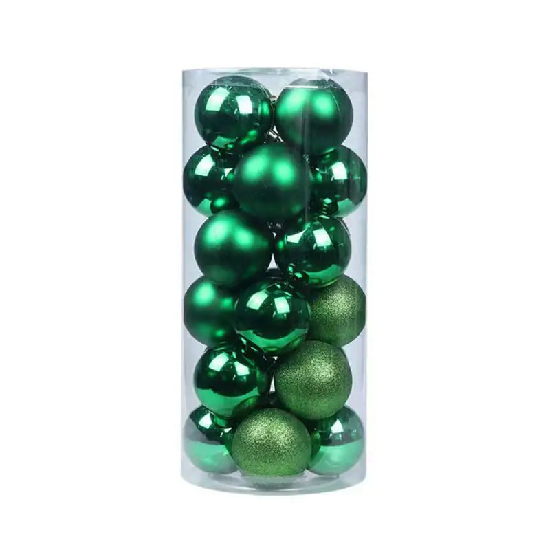 A transparent cylindrical container filled with shiny and matte green Christmas tree baubles stacked neatly inside.