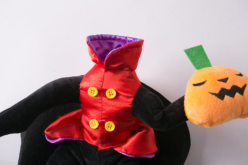 Headless stuffed figure in a red coat with yellow buttons, holding a plush jack-o'-lantern. The coat's interior is purple, and its arms are black.