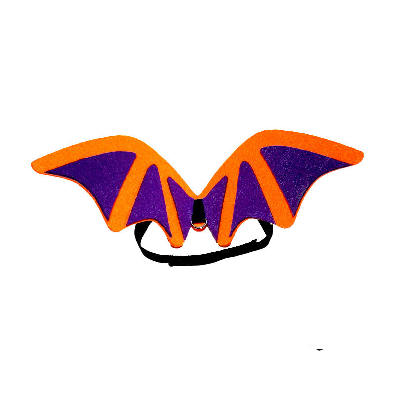 Orange and purple bat wings costume with an adjustable black strap for pets or small animals, isolated on a white background.