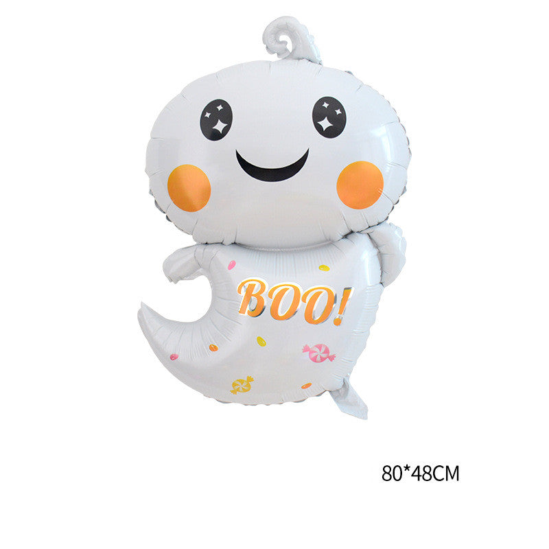 Cute ghost-shaped balloon with a smiling face, orange cheeks, and the word "BOO!" in the center, measuring 80x48 cm. Decorated with colorful candy designs.