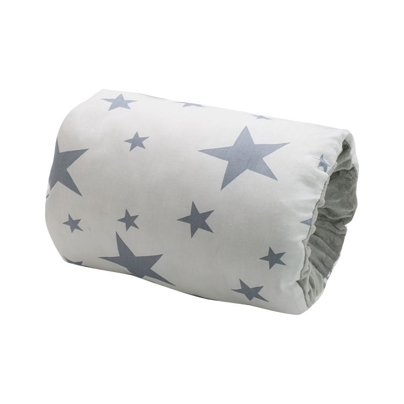 A white duvet with blue star patterns, rolled up for storage or transport, with a visible soft interior lining.