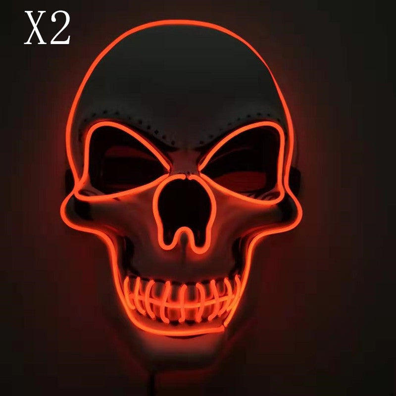 Glowing red neon skull on a dark background, featuring hollow eyes and a grinning mouth. The number "X2" is displayed in the top left corner.
