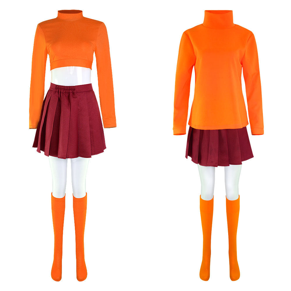 Two mannequins display matching outfits: one with a cropped orange top, maroon skirt, and knee-high socks; the other with a long orange turtleneck, maroon skirt, and socks.