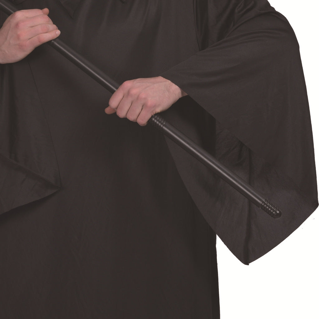 Person in a black robe holding a black staff with both hands. The focus is on the hands and the upper part of the staff.