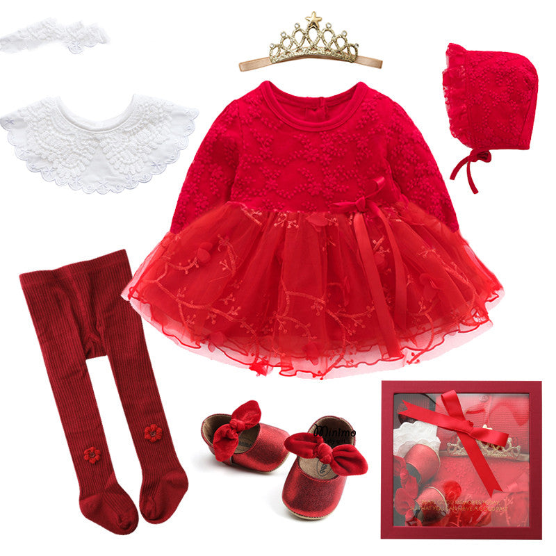 Red toddler outfit set featuring a lace dress, matching bonnet, tights, shoes with bows, a white collar, and a tiara, presented in a gift box.