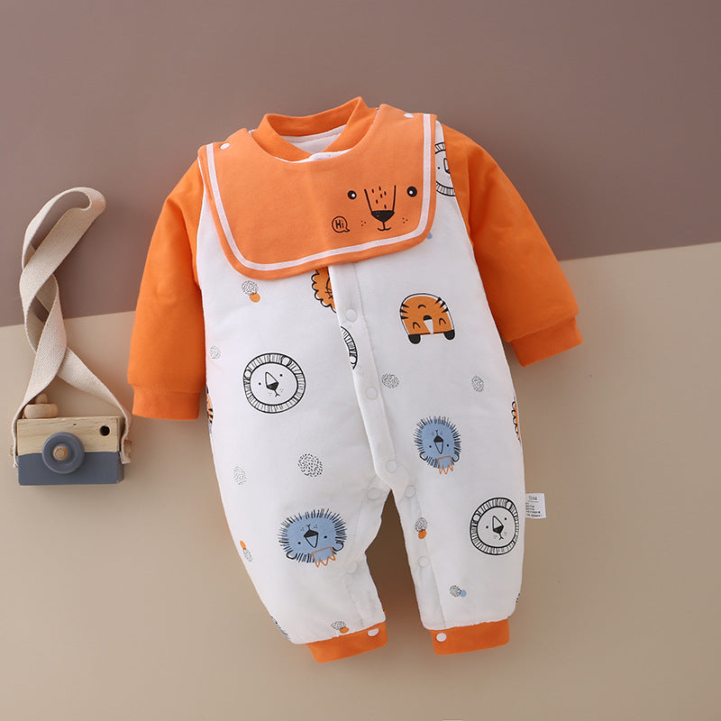 Orange and white baby romper with lion and hedgehog illustrations. The romper has orange sleeves and collar. A small wooden toy camera with a strap is placed beside it.
