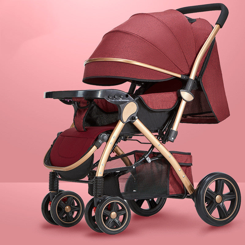 Red baby stroller with a gold frame, featuring a large canopy and storage basket, set against a pink background. It has four wheels with black and red accents.