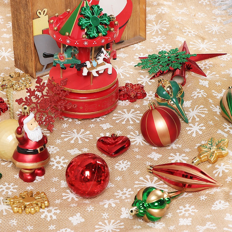 Festive Christmas scene with a red carousel, Santa figurine, red and gold ornaments, and snowflake patterns on a burlap surface, creating a warm holiday atmosphere.
