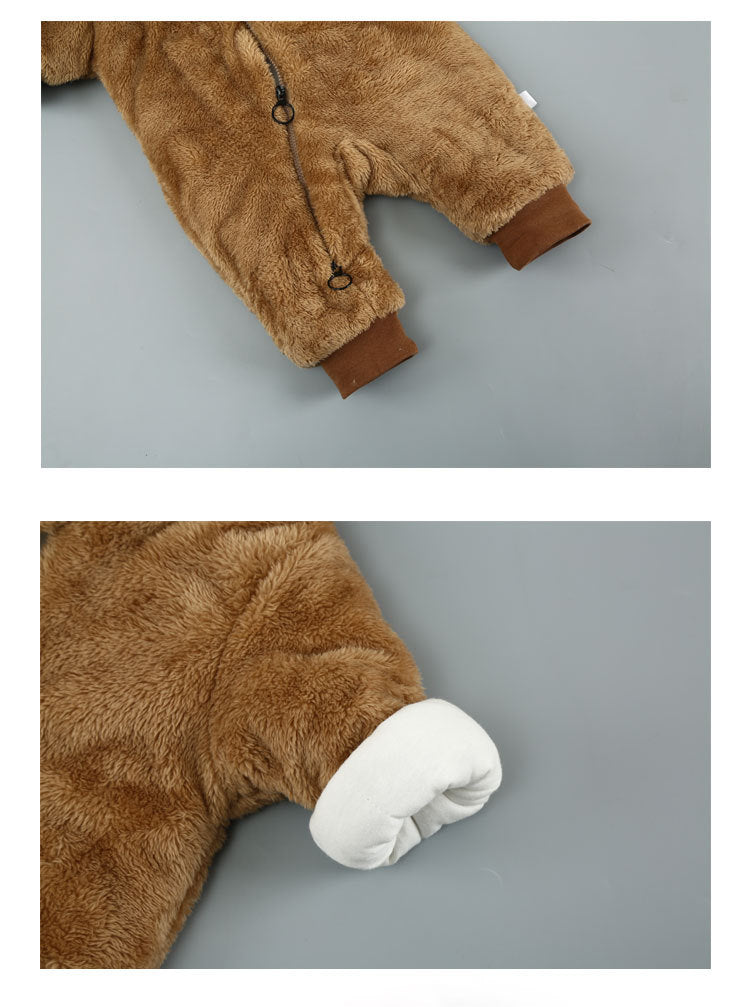 Brown fuzzy baby jumpsuit with a front zipper and brown cuffs, lying on a gray background. Close-up shows a sleeve with a white inner fabric folded over.