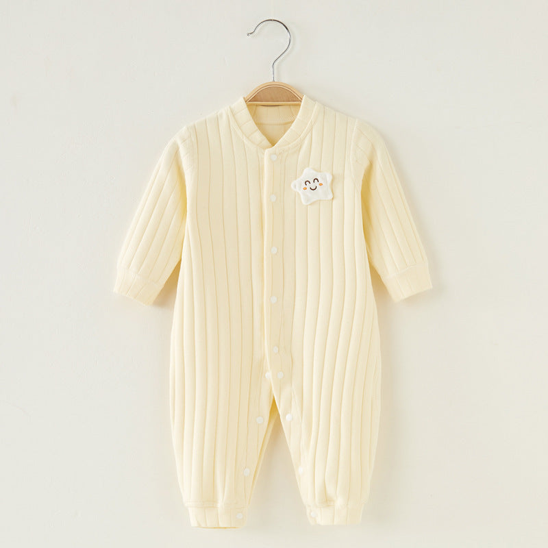 Cream-colored ribbed baby romper with long sleeves and a smiling cloud patch, hanging on a wooden hanger against a white background.