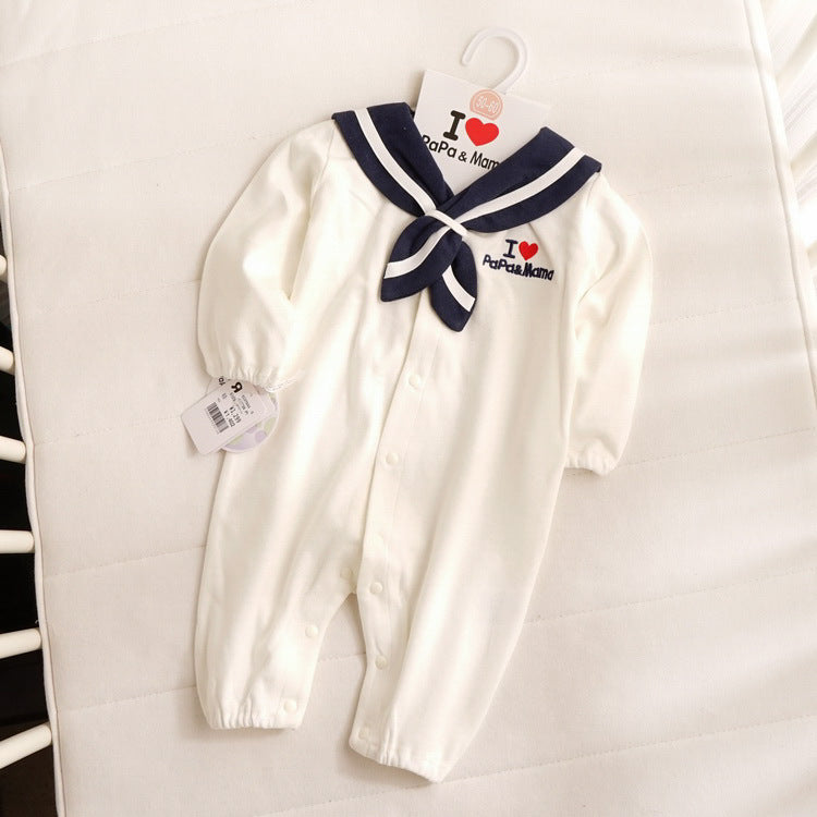 White baby onesie with navy sailor collar and bow, featuring "I ♥ Papa & Mama" text. The outfit has snap buttons and a tag attached, laid on a white background.