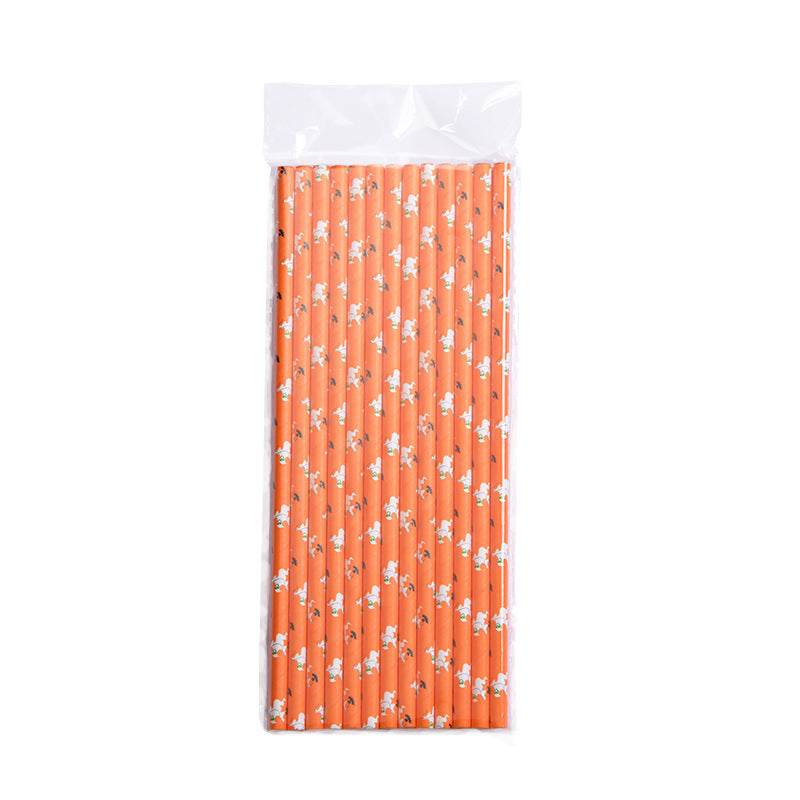 A pack of orange drinking straws decorated with small white ghost patterns, neatly arranged inside a transparent plastic package.