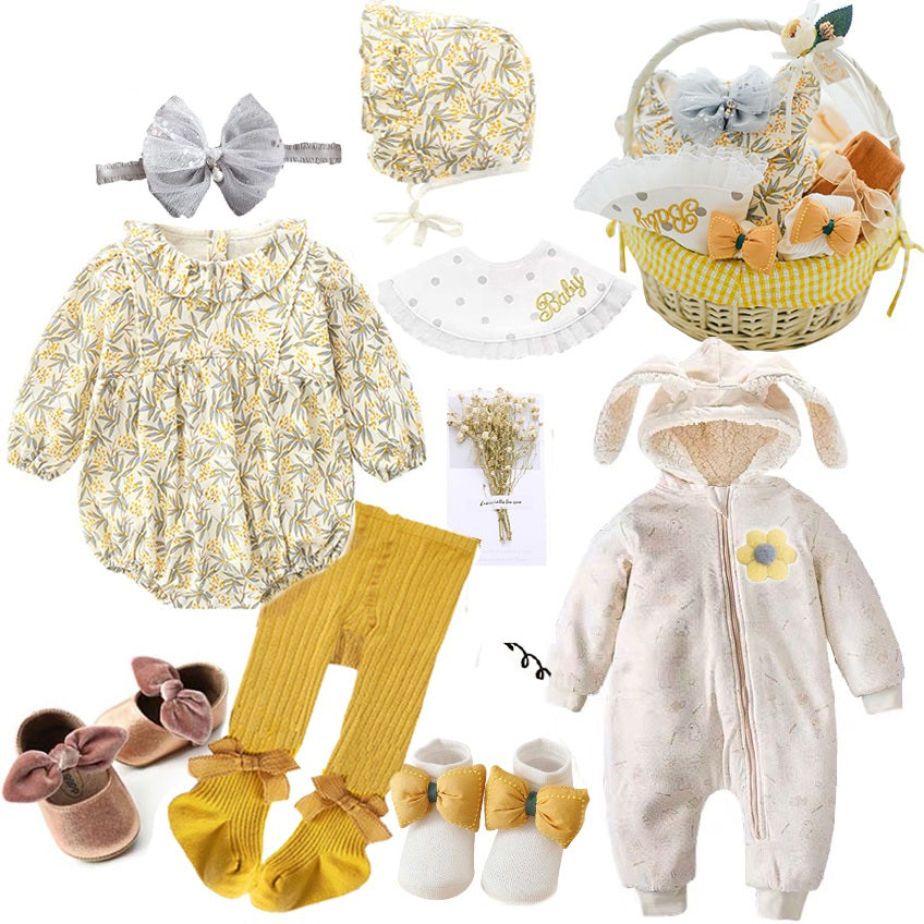 Baby gift set with floral romper, matching bonnet, gray headband, bib, booties, and a bunny onesie. Includes socks, shoes, mustard tights, and a decorative basket.
