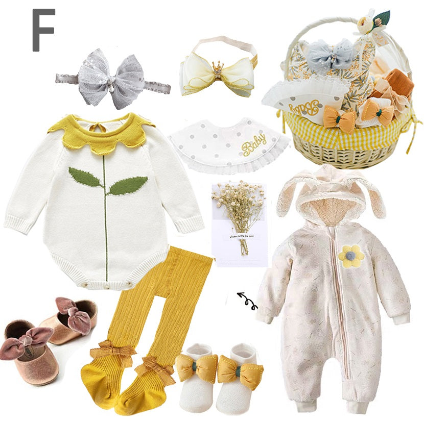 Baby clothing set featuring a white outfit with green leaf design, yellow tights, pink shoes, headbands, a hooded onesie with bunny ears, and a basket with baby accessories.