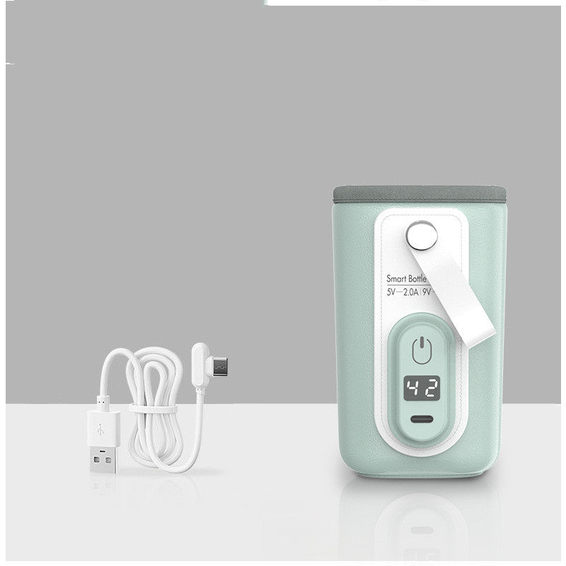 Mint green smart bottle with digital display showing "42," featuring a power button and a strap. A white USB charging cable sits beside it on a reflective surface.