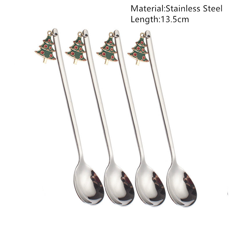 Four stainless steel spoons, each 13.5 cm long, with a Christmas tree charm at the handle's end. Text describing material and length is visible in the top right corner.