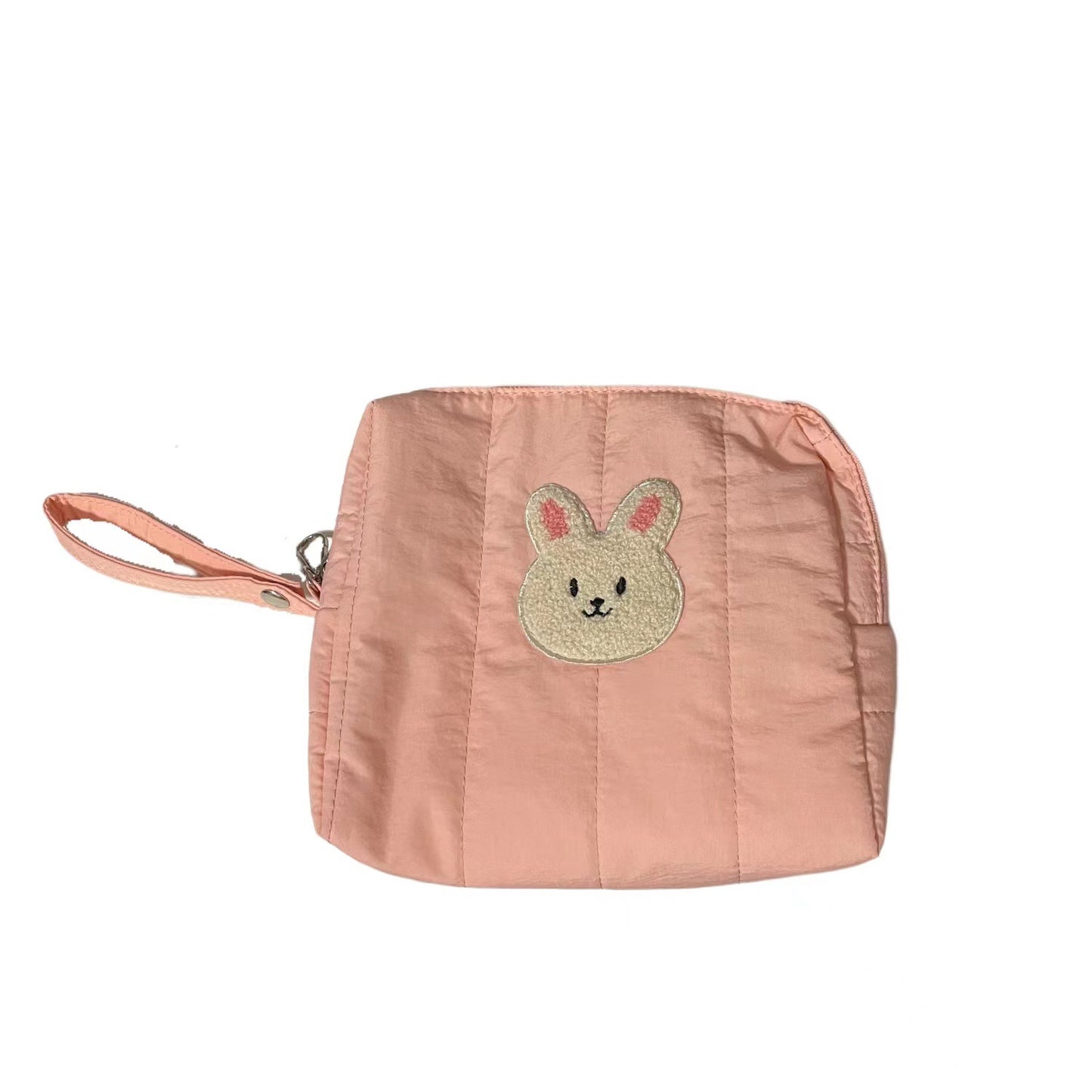 Pink fabric pouch with a cute embroidered bunny face on the front. The pouch features a matching strap and a zipper closure.