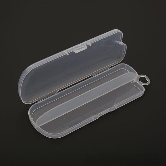 Transparent plastic pencil case open, displayed on a dark background. The case has rounded edges and a simple clasp, with a heart-shaped loop on the side for attachment.