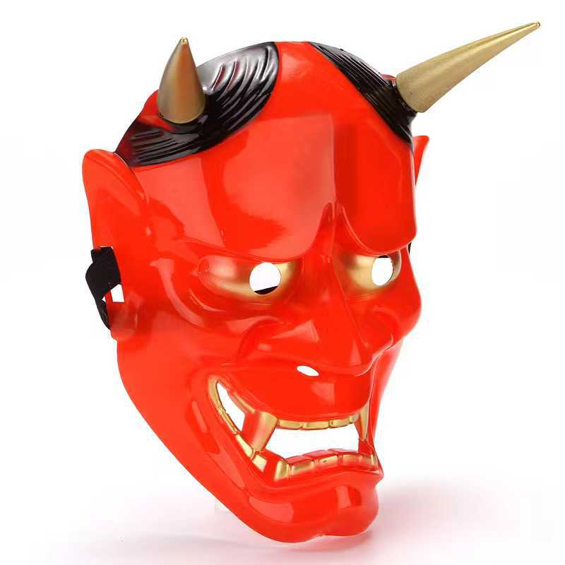 Bright red devil mask with horned head, black accents, and open mouth, featuring gold eye and mouth details.