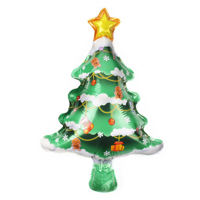 Green Christmas tree balloon with a gold star on top, decorated with gingerbread men, snowflakes, ornaments, and presents, set against a white background.