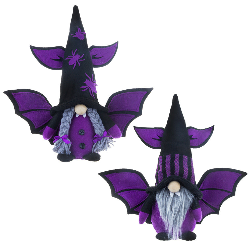 Two whimsical Halloween gnomes with purple bat wings and hats. The left gnome has spider motifs and braided hair, while the right gnome has a striped hat and a long beard. Both have round noses and are dressed in black and purple with matching gloves and shoes.