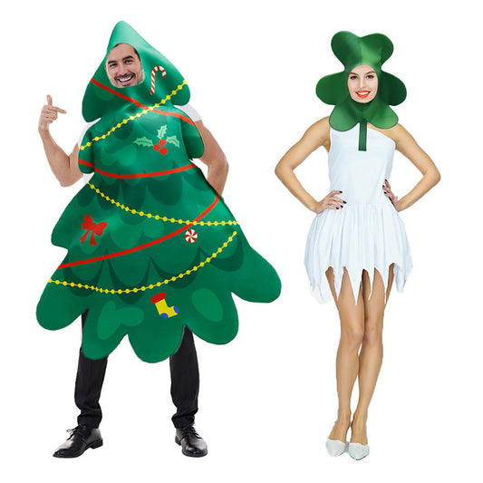 A person in a Christmas tree costume with ornaments and another in a white dress with a clover-shaped headpiece stand side by side, both smiling against a white background.
